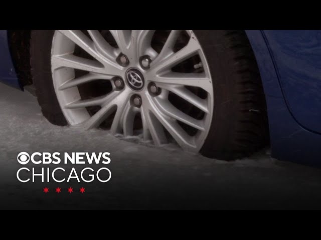 Cars frozen to the street on icy block in Bucktown