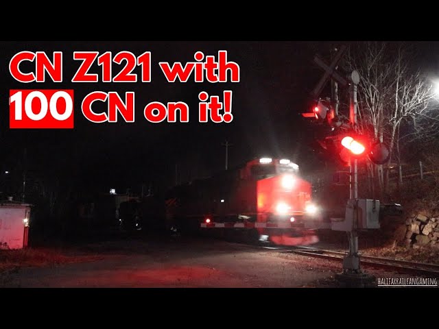 CN 3051 Leads Z121 with 100 CN at Shore Drive Level Crossing, Bedford, NS.