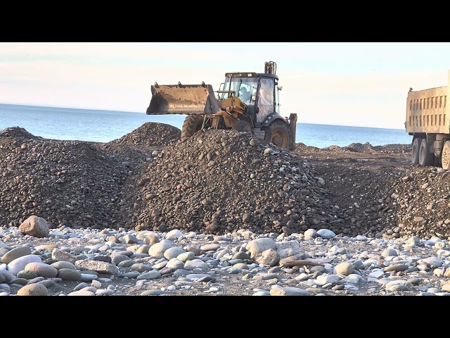 Professional builders are building a mega structure using construction equipment