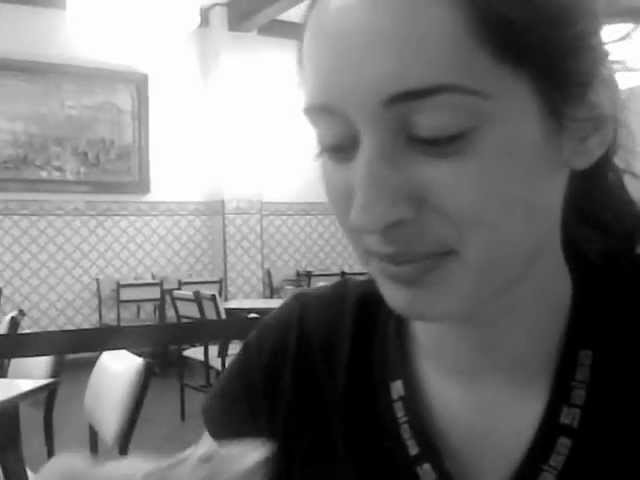 Nadia, a beautiful Portuguese girl eating pastries of Bethlehem - Pasteis de Belém