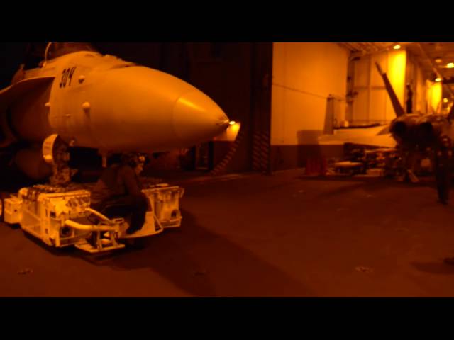 Sailors Move Aircraft in the Hangar Bay Aboard USS Harry S. Truman (CVN 75)