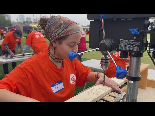 Tampa Bay Sun FC players trade cleats for tool belts to build beds for children in need