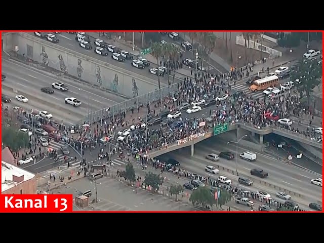 Protesters march in downtown Los Angeles and Phoenix to protest Trump’s mass deportation plans