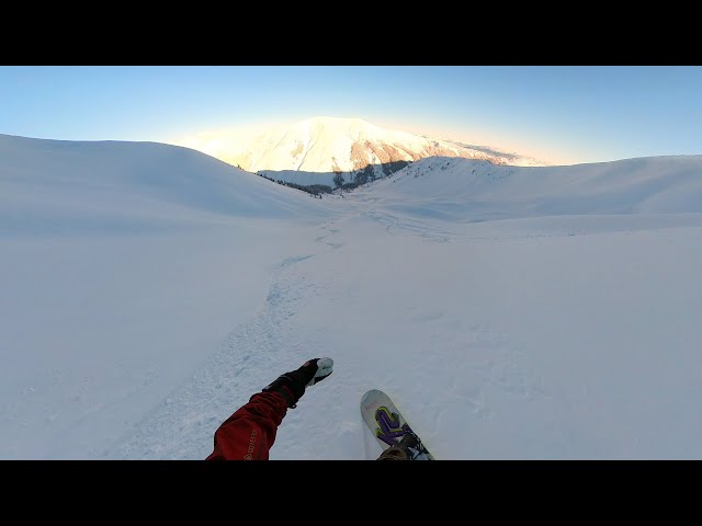 VR 360 Snowboard floating down a perfect line at the end of the day