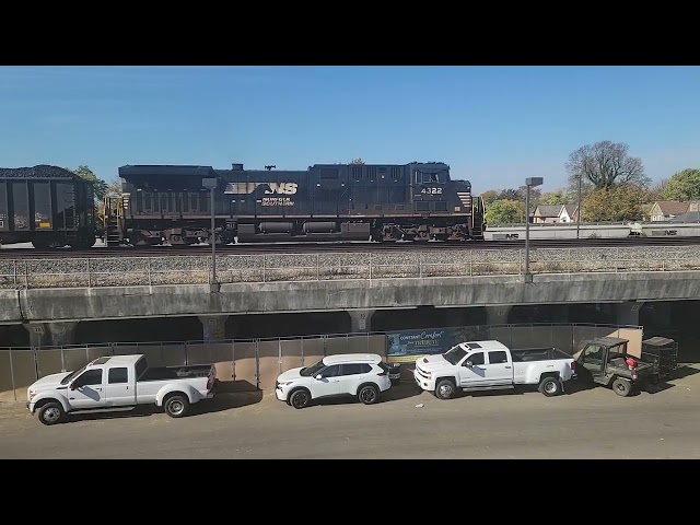 Norfolk Southern Grainer ducks below loaded Coal Train, Columbus Ohio 10/23/2024.