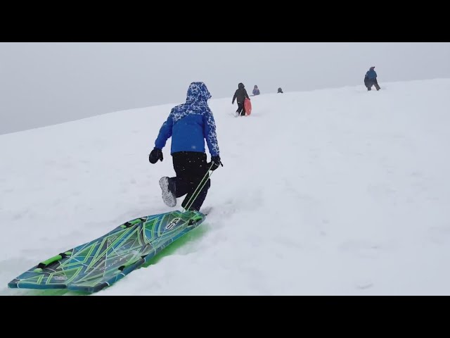 Johnson County families hit the hills for sledding fun