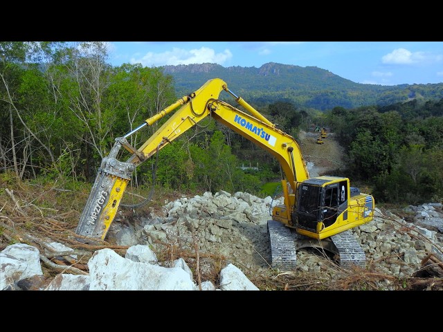 Komatsu Excavator Digging Excavating Hilltop To Make A New Limestone Road