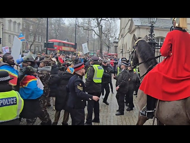 PROTESTERS STORM HORSE GUARDS CORPORAL ORDERS EMEGENCY LOCK DOWN AS PROTESTERS HEAD FOR THE GATE