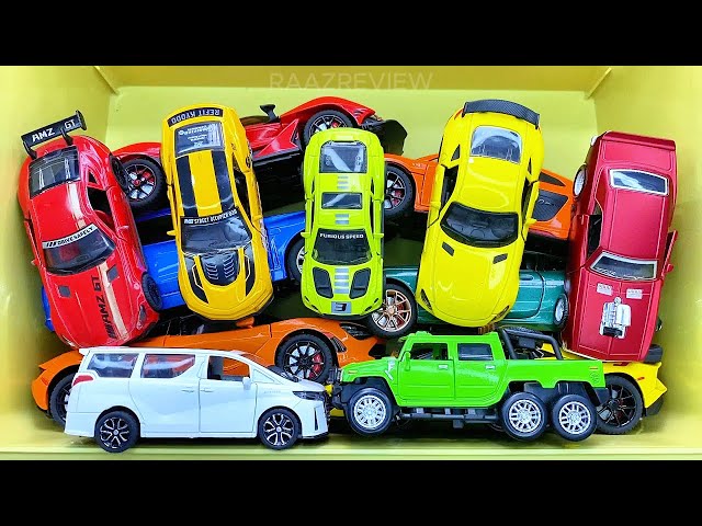 Box full of various miniature cars Peugeot, Volvo, Renault, Hyundai, Pagani, Cadillac One, DHL 13