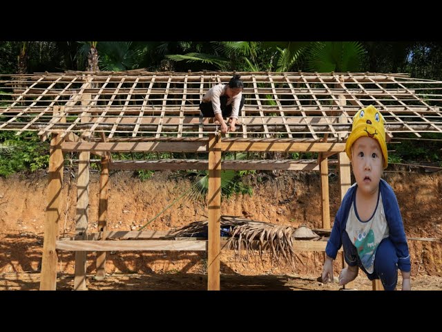 Vietnamese single mother completes roof on rainy day