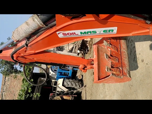 Tractor attached backhoe