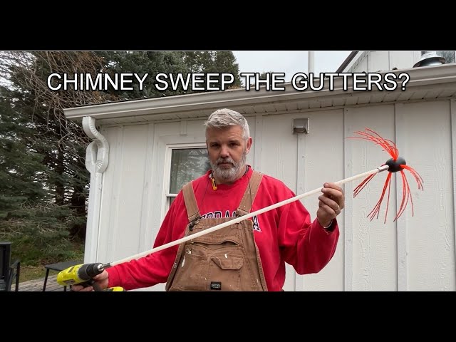 Gutter cleaning with a chimney sweep brush