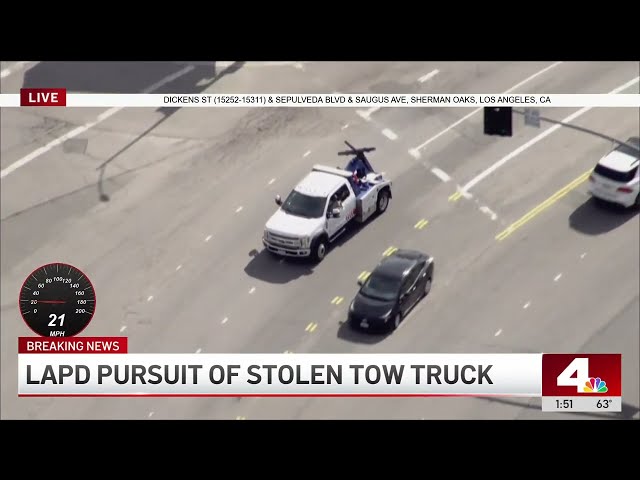 Live: Police chase stolen tow truck