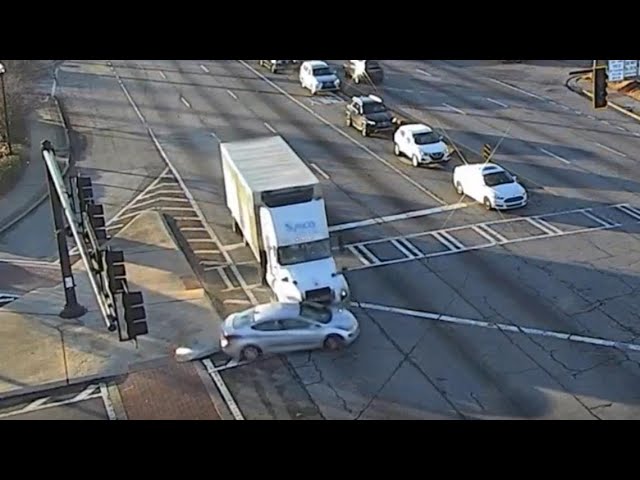 Truck hits car, keeps pushing it through two intersections | Traffic & dashcam video