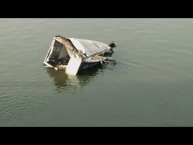 One rescued after two vehicles plunge off Twin Span Bridge, prompting water rescue