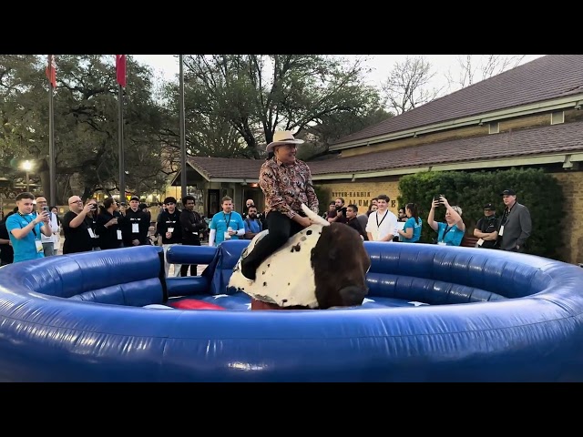 Joey riding the mechanical bull at Civo Navigate North America