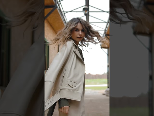 Vertical of Trendy Confident Woman Walking and Spinning in Stable