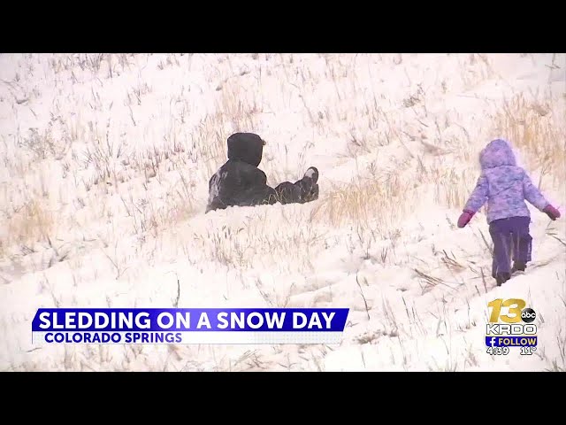 Sledding on a snowy day in Colorado Springs