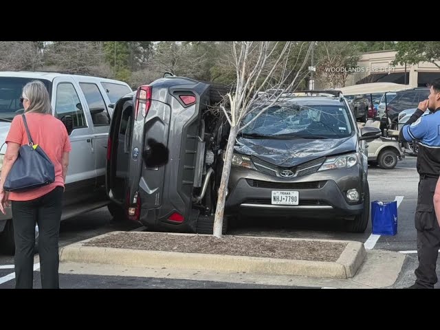 Driver ends up wedging his car sideways between two parked cars in Houston-area parking lot