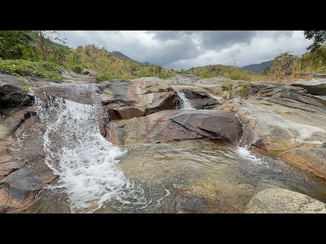 Relax with the soothing sounds of nature, featuring a serene calming waterfall at Oral Mountain 🏔️