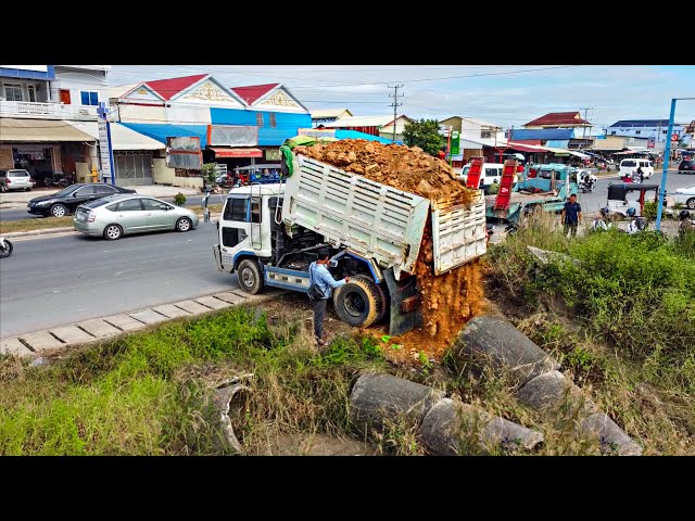 Start a new project!! Filling Land by Dump Truck Unloading soil with Mini Bulldozer