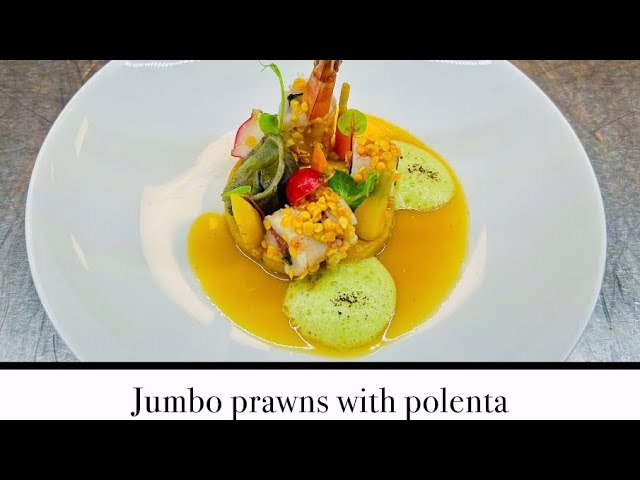 Bresaola and chives stuffed jumbo prawn with fried polenta green peas basil form and fried lentil