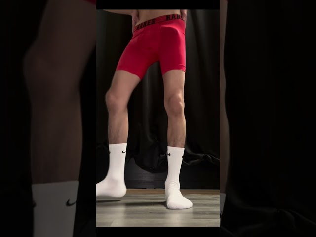 Boy trying on different red boxers briefs