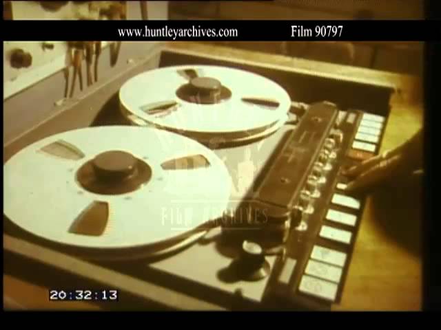 Close up of a reel to reel tape recorder.  Film 90797