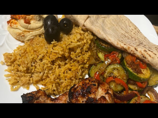 Mediterranean Chicken Homemade Rice Pilaf and Some Yummy Veggies With Hummus and Pita Bread