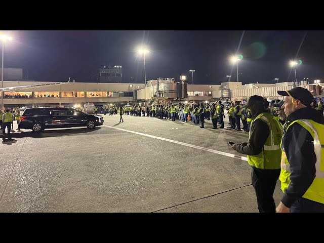 Crews line tarmac as body of flight attendant killed in DC plane crash returned to Charlotte