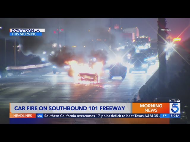 Car catches fire on busy downtown Los Angeles freeway