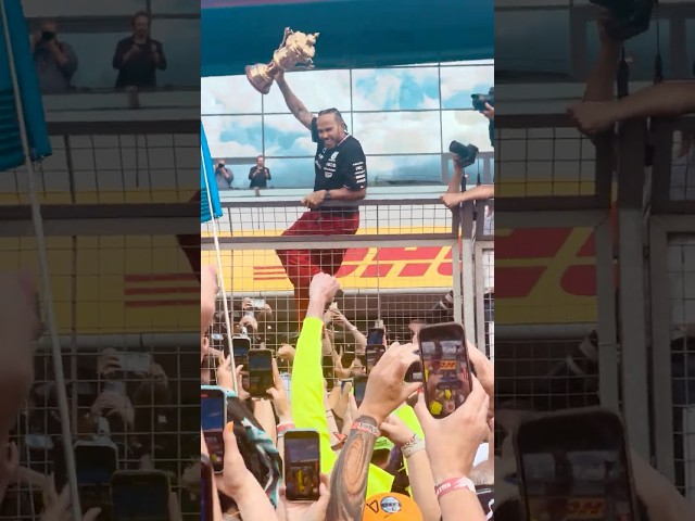 Lewis Hamilton celebrates winning the 2024 British Grand Prix with fans