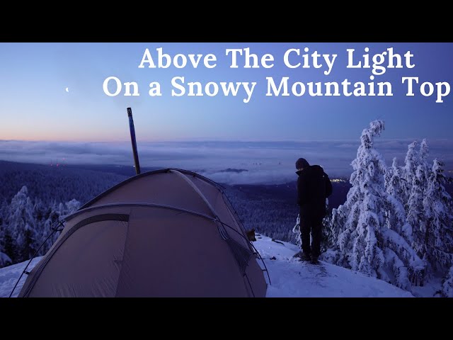 Winter Hot Tent Camping on Mountain Top by a Cliff Overlooking the City