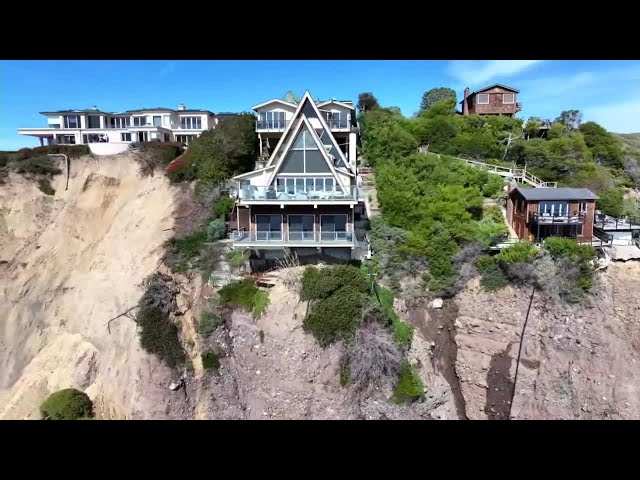 Massive landslide on coastal bluff leaves Southern California mansion on the edge of a cliff