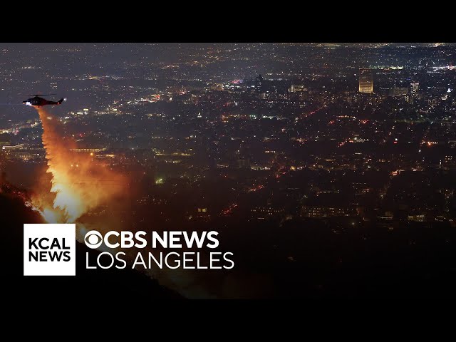 Residents react after being forced to evacuate from homes due to Sunset Fire