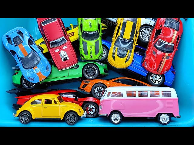 Box full of various miniature cars Jaguar, Peugeot, Renault, Hyundai, Mazda, Volvo, Honda, Opel