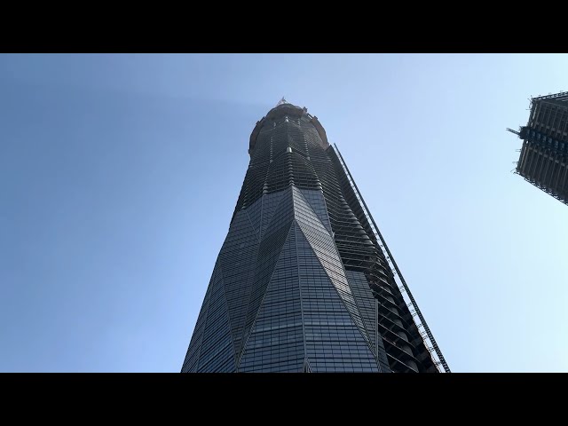 How is the construction of the tallest building in southwest China, which cost US$165 million, going