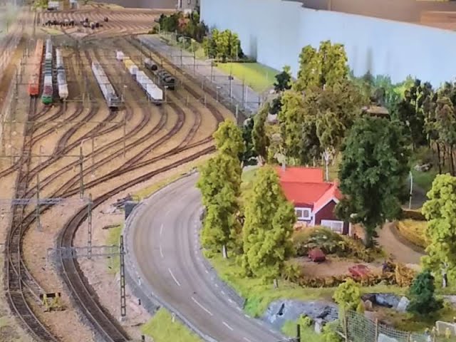 The Model Railroad in Hallsberg, Sweden, with freight yard. Text, subtitles in some languages.