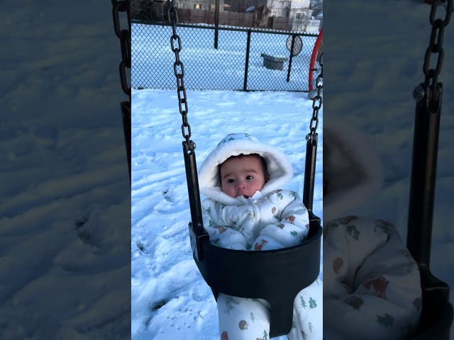 6 month old swinging in the snow #cutebaby#baby#cute#funnyshorts #funny#loveheals#snow#play