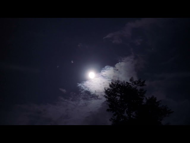 Beautiful full Moon in clouds | Clouds Moving Over a Night Sky's Nearly Moon | Full moon HD video |