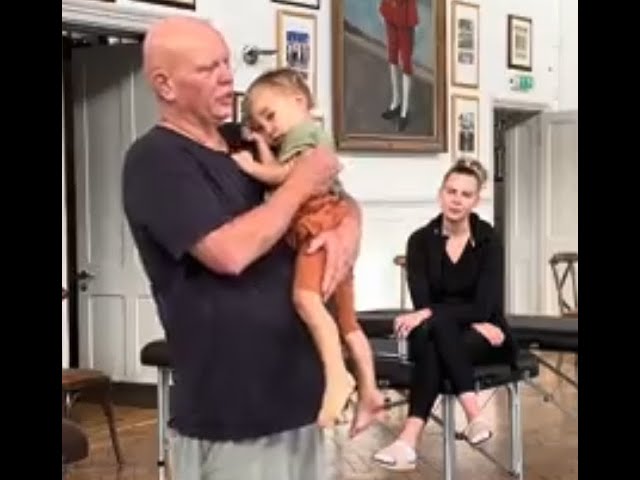 How to massage a toddler. Brandon massaging his son Ephrem during the recent London Advanced Course.