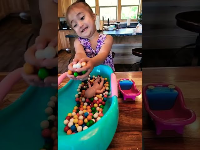 Cute Baby Girl & Baby Doll Playing with Gumball Candy in the Bath #satisfying #asmr #shorts #baby