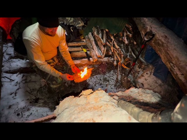 Survival Shelter Winter Camping - Building and sleeping in a primitive shelter in 16 degrees!