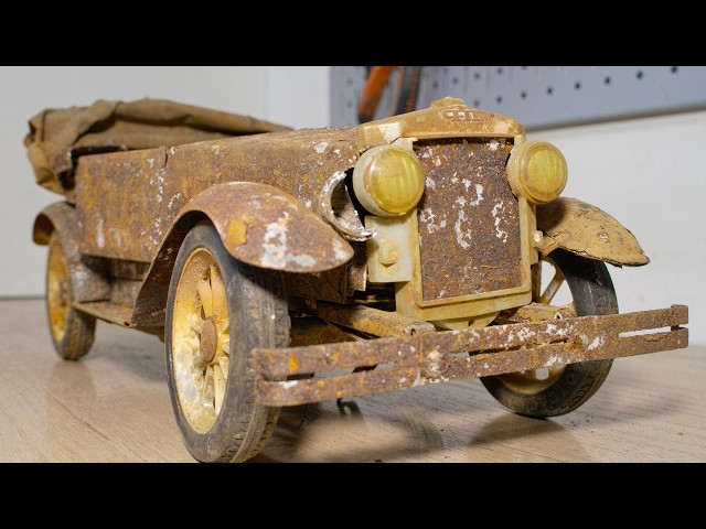 Restoration of an old toy car Phaeton