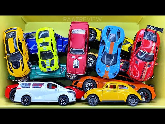 Box full of various miniature cars Peugeot, Volvo, Renault, Hyundai, Pagani, Cadillac One, DHL 13