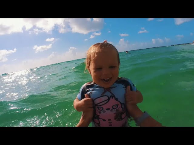 Naomi is swimming on her back for first time in the Ocean at Miami Beach