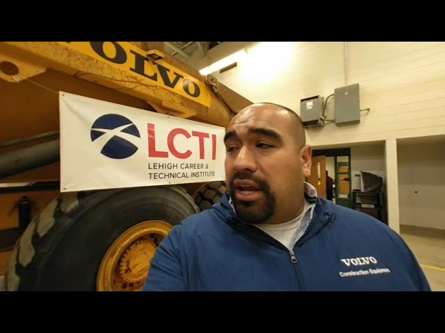 Juan Ibarra from Gold Rush gives a tour of Volvo dump truck donated to LCTI