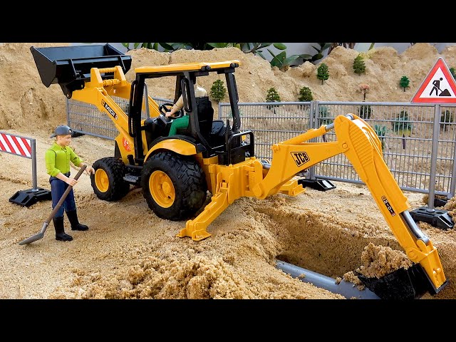 Kendaraan konstruksi excavator mobil truk mainan di tempat kerja